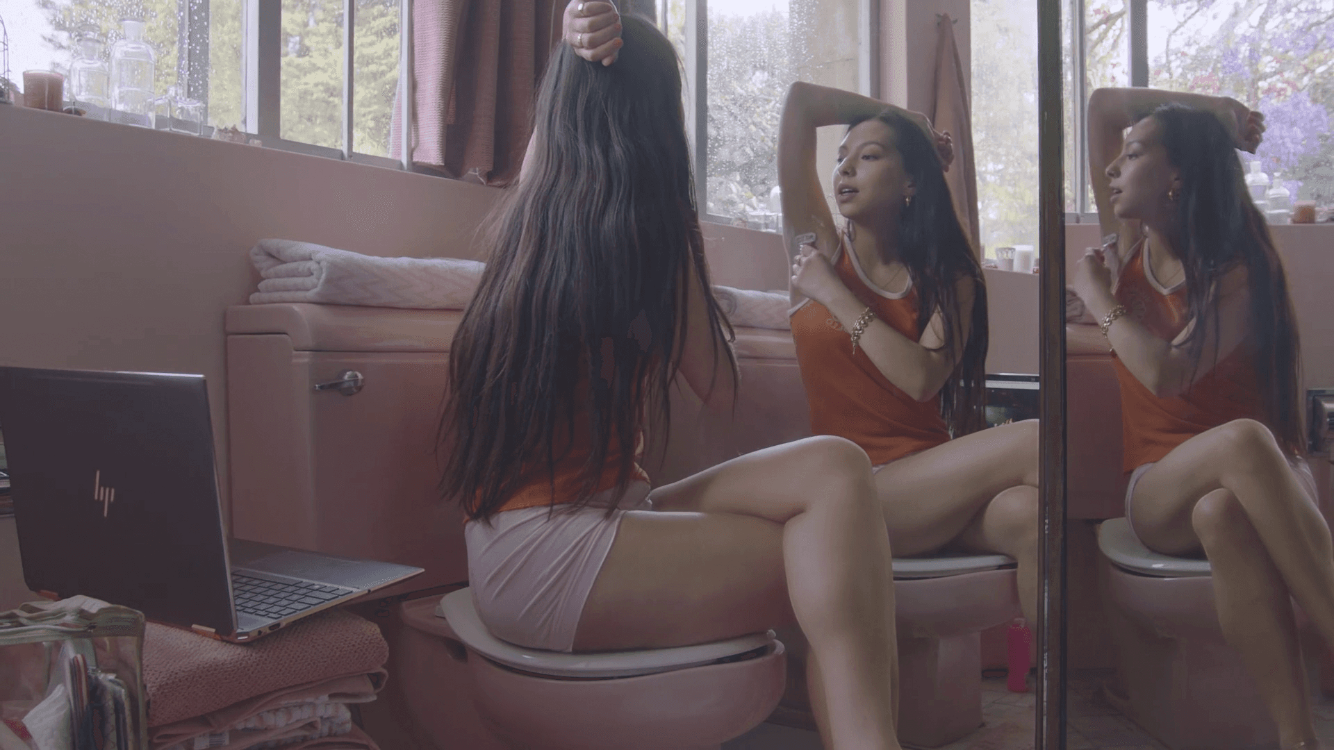 Silhouette of a person walking on a modern walkway