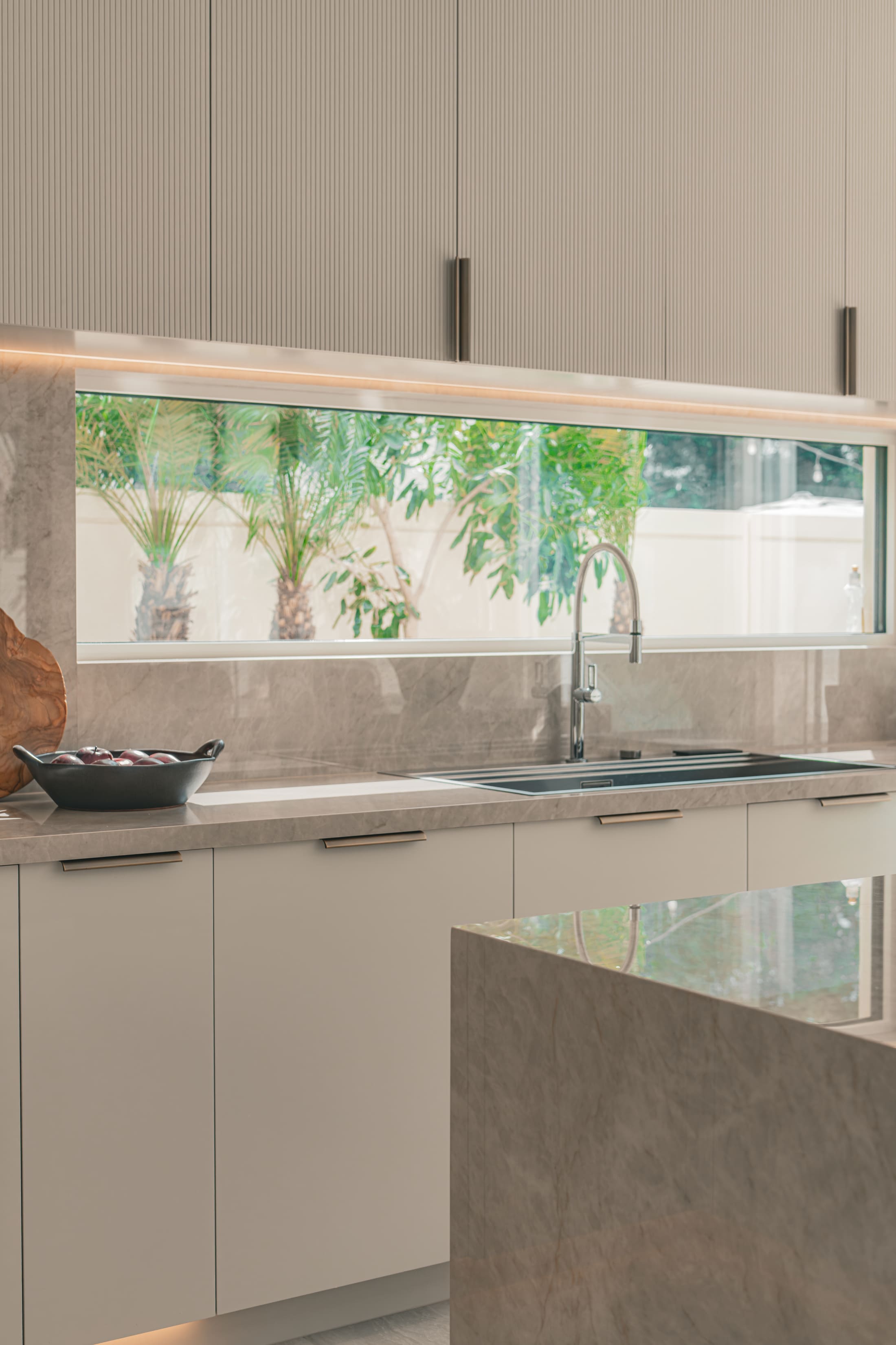 Image of a large villa with big glass windows