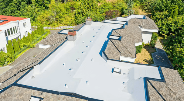 a man in a yellow shirt is working on a roof