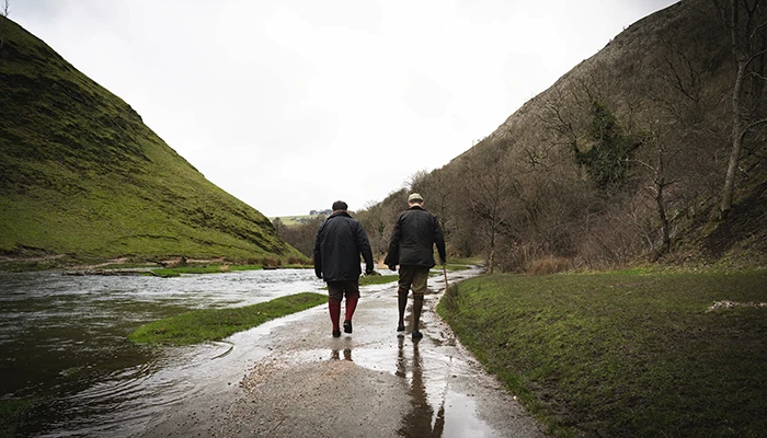 Two men enjoying a peaceful walk in derbyshire peak district