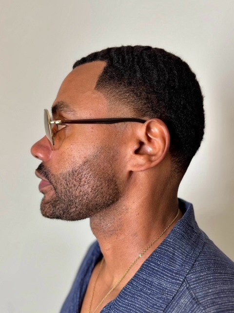 Bright blond fade with a bold, modern edge tailored for men by expert barber Courtney Palmore.