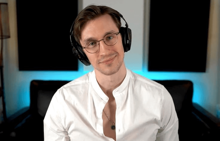 headshot of male in dark background