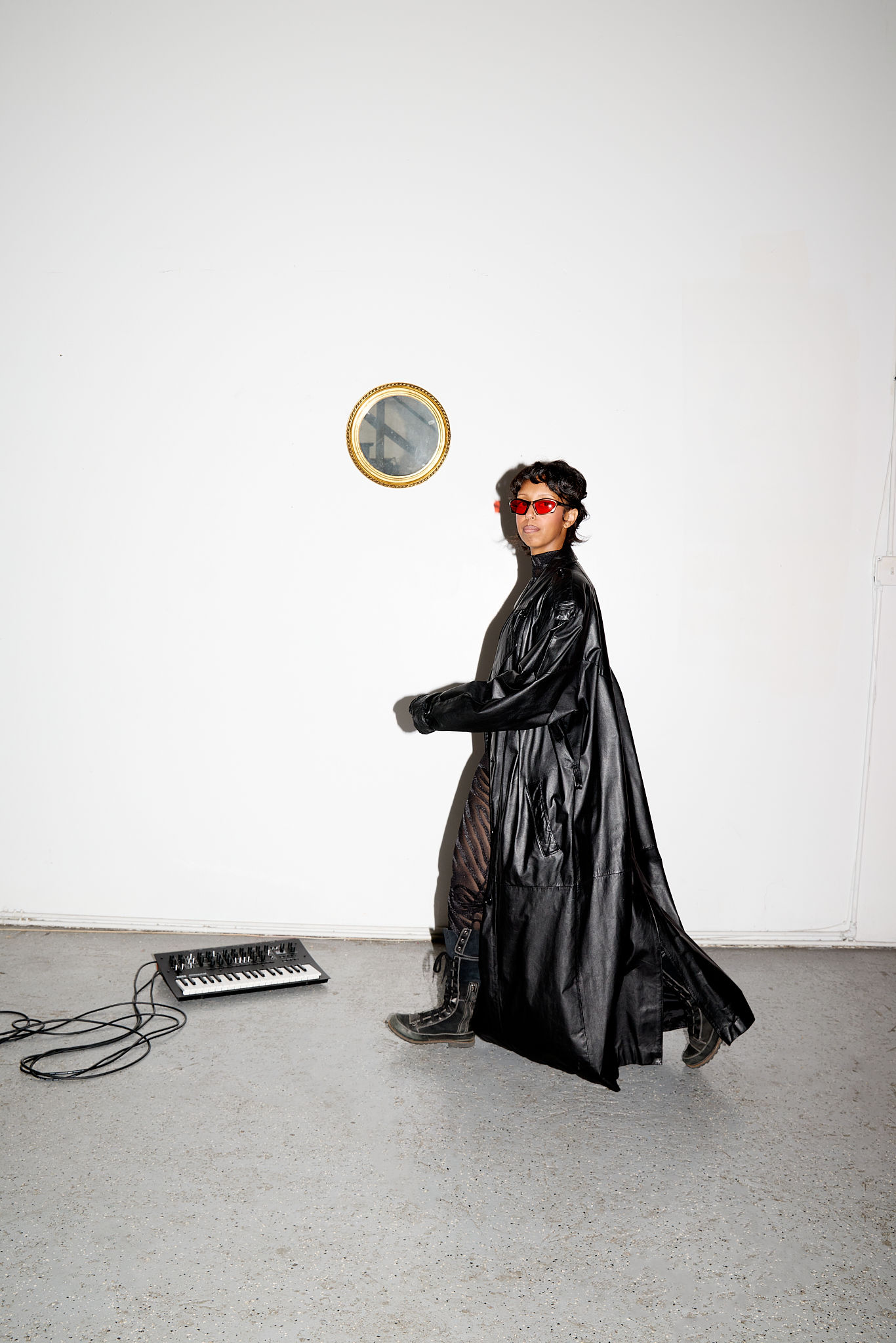 Woman with red hair covering mouth with hair