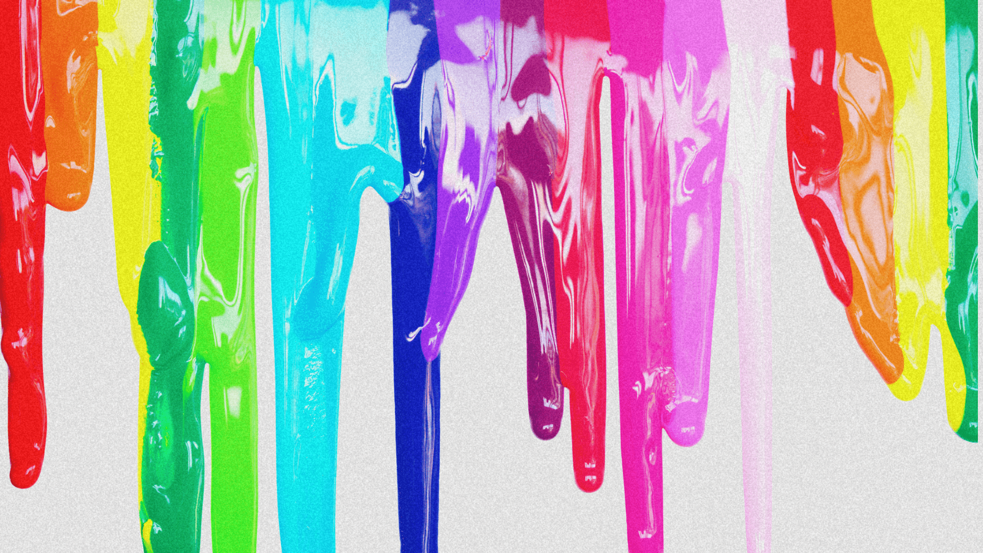 Colorful paint drips in vibrant hues of blue, green, yellow, pink, and purple against a white background.
