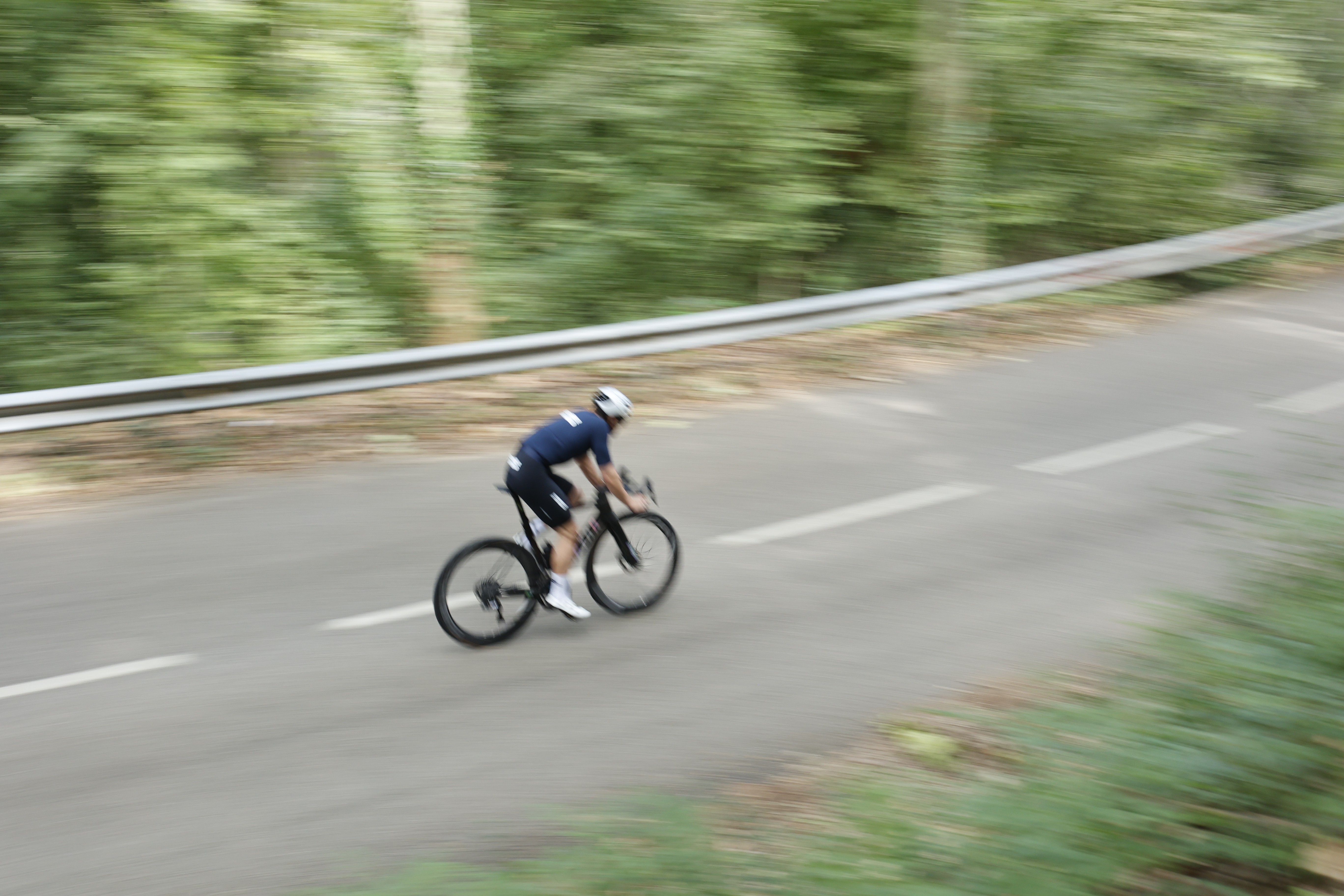 person holding pen with coffee on table