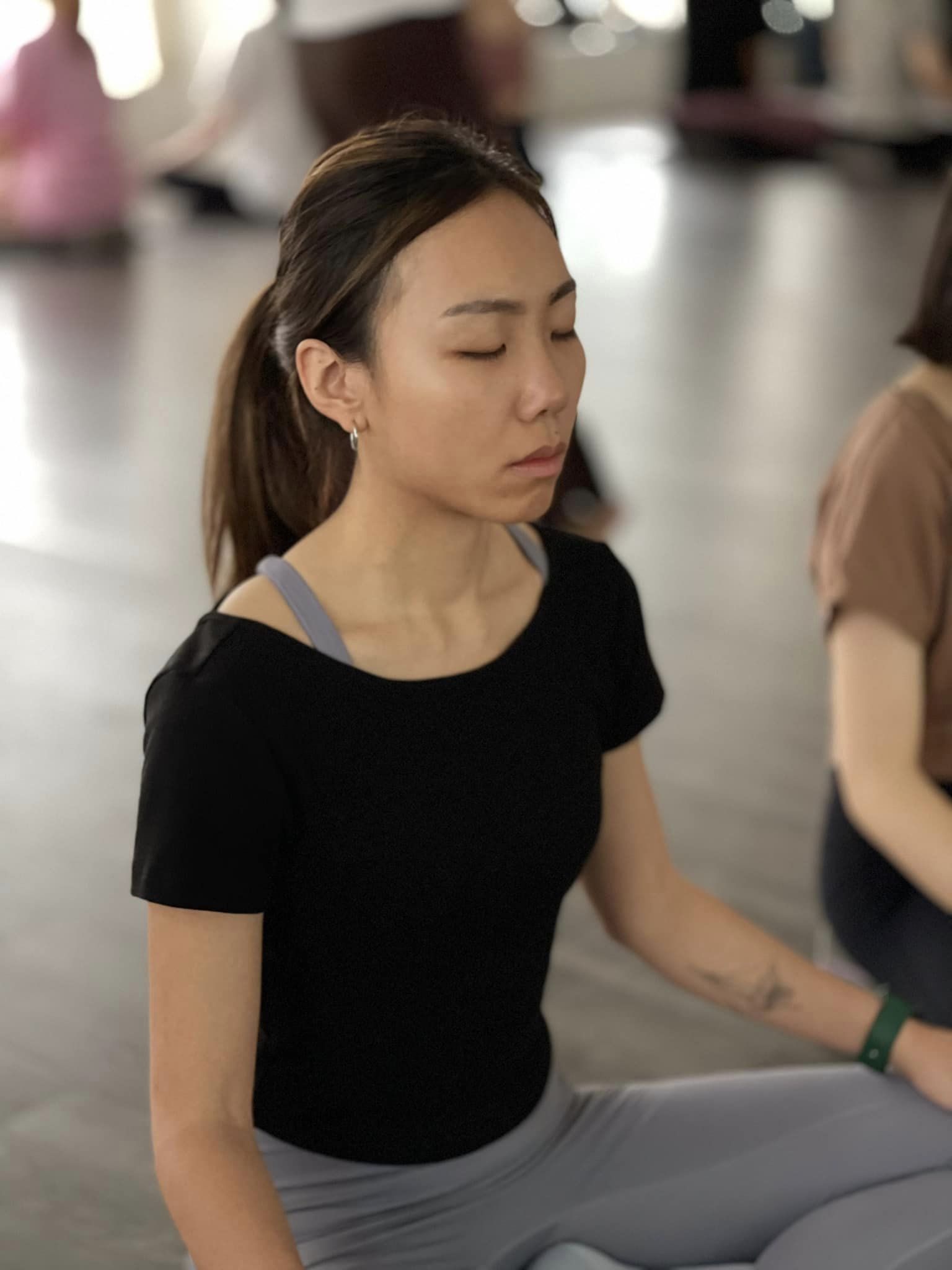 people in a large building with Tate Modern in the background