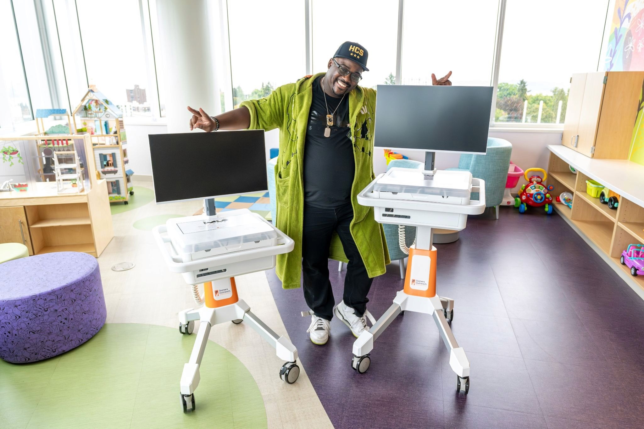 Halo Franchise Ambassador Ron Brown poses with two GO Karts, donated with the funds raised at HaloWC last year