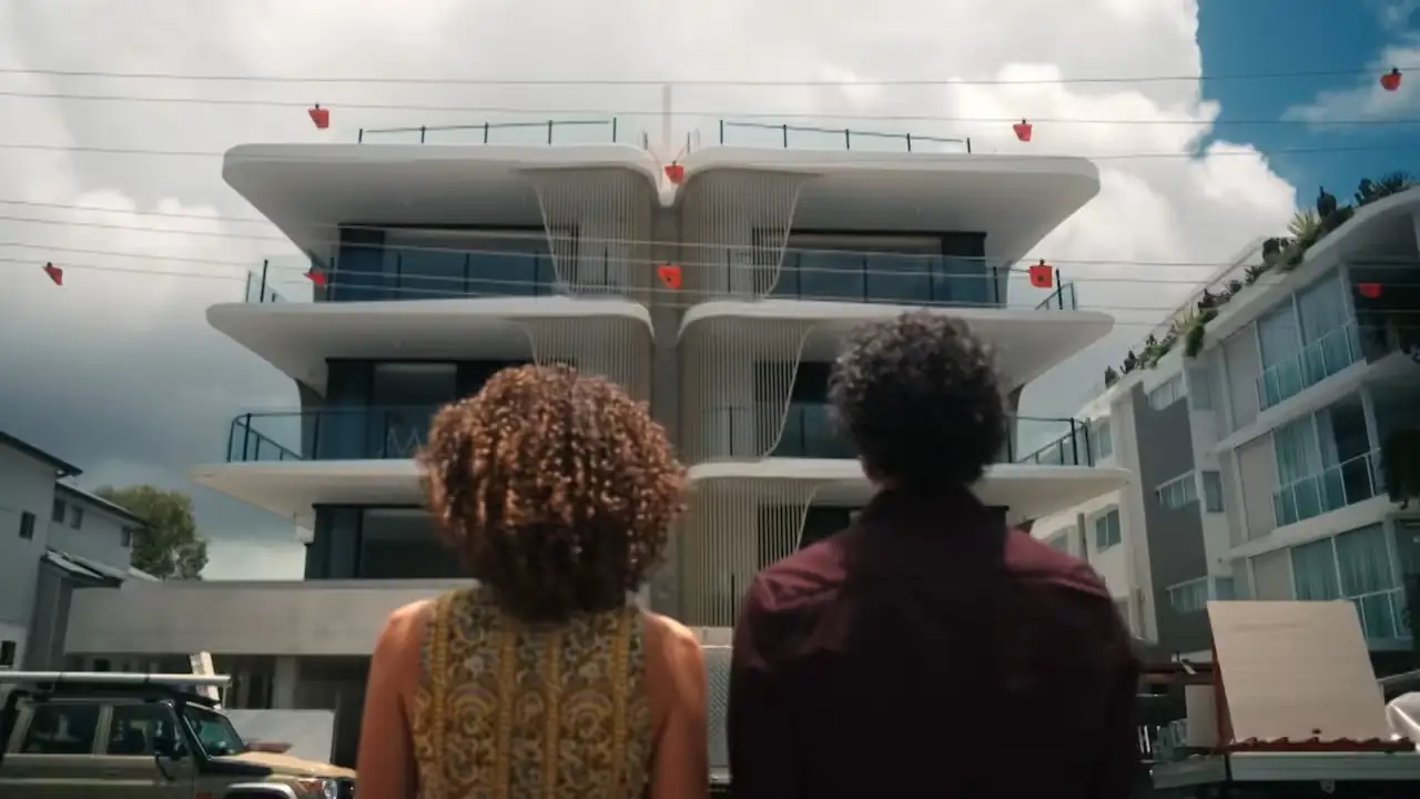 2 people looking at the front of a building