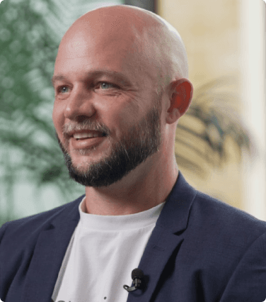 professional photo of ben doidge at experieco in a business jacket with a white shirt
