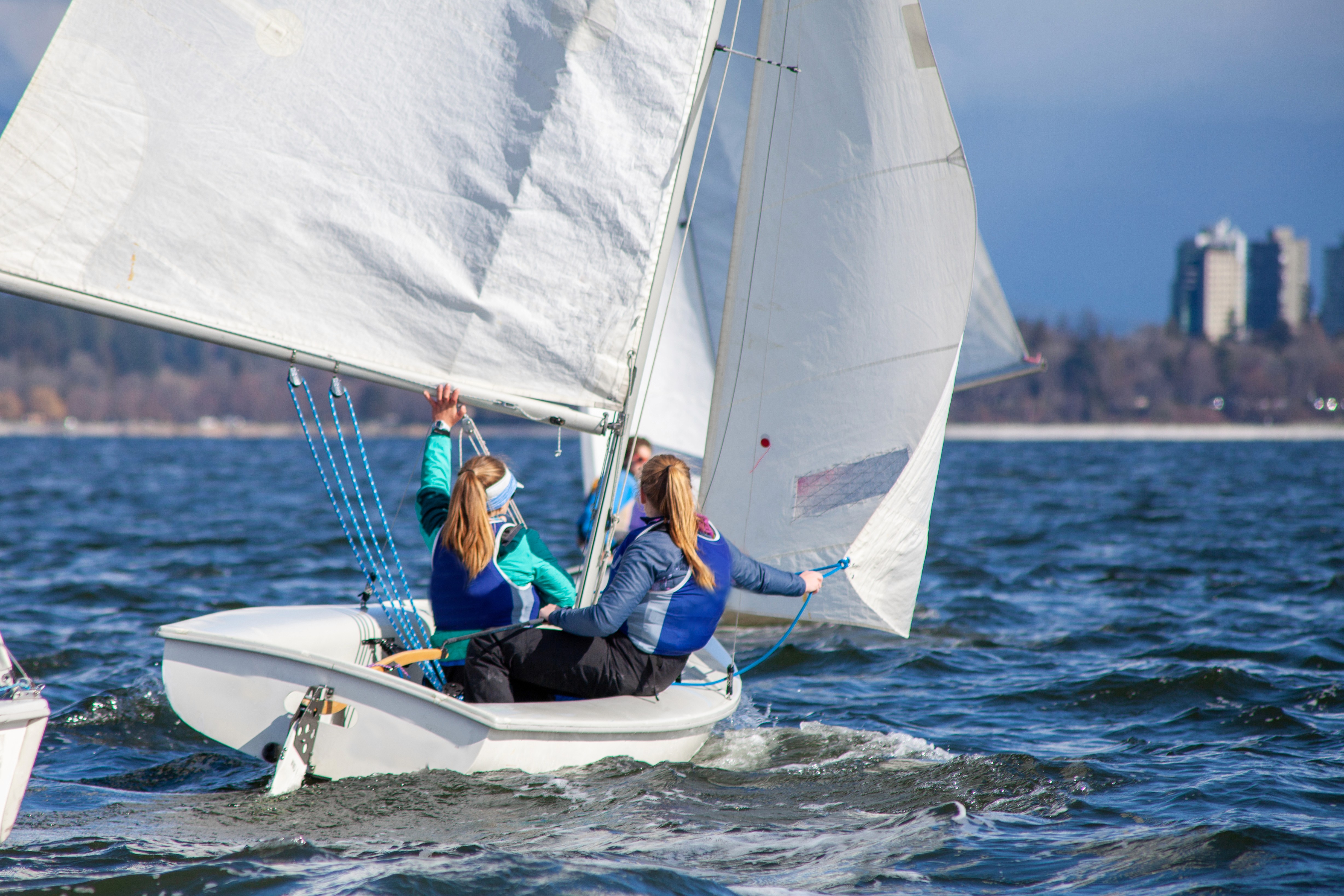 2 person surfing on sea during daytime