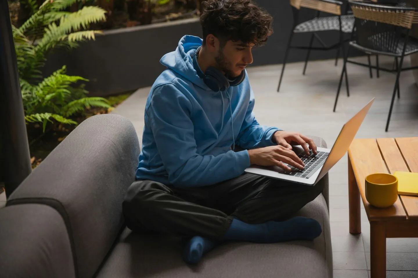 a man sitting at a desk using a computer