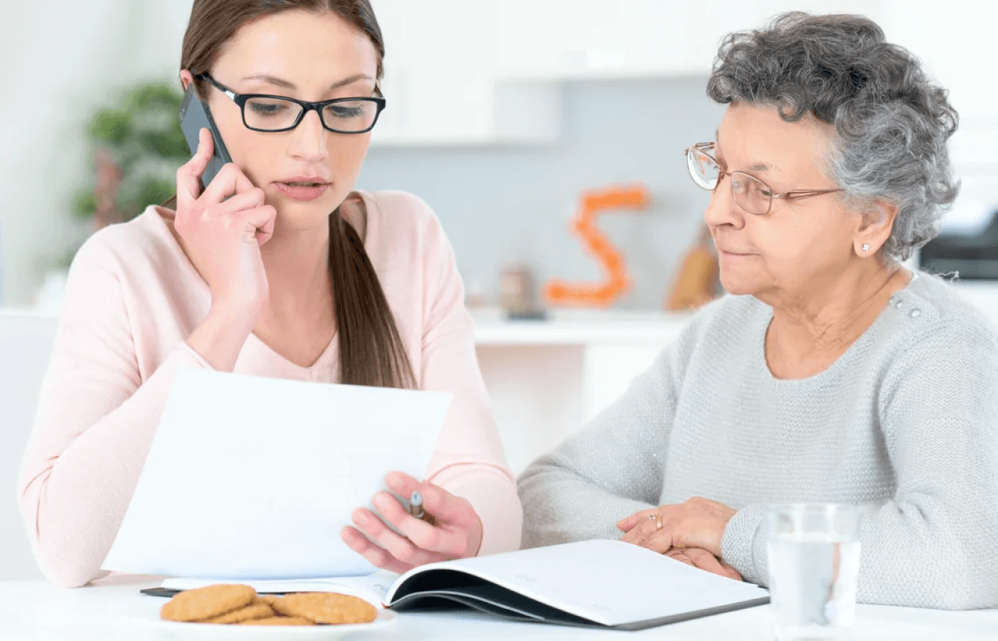 Helping senior woman with her finances