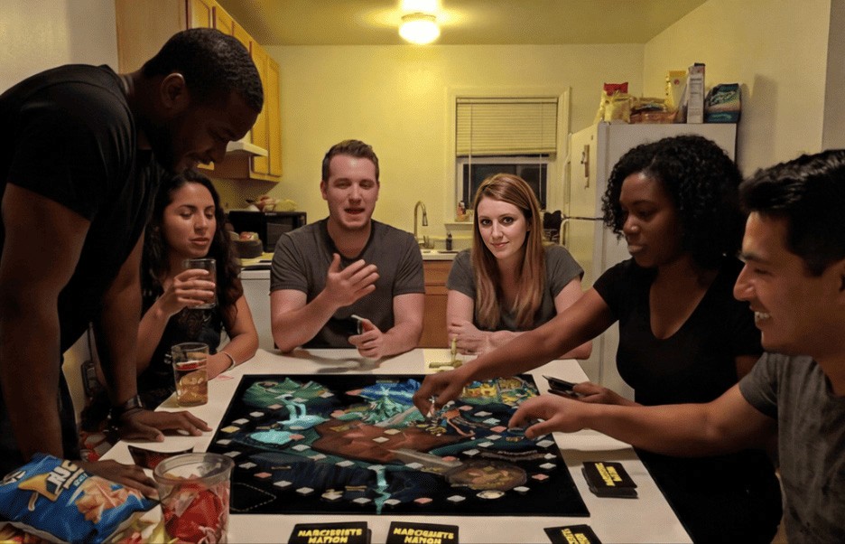 6 friends playing a board game in relaxed settings.
