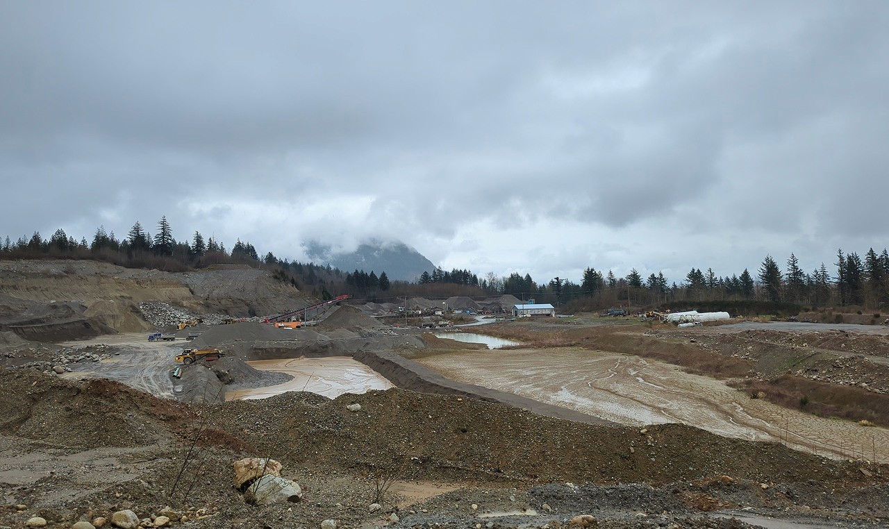Active gravel pit operations with multiple settling ponds at Woodbrook Aggregates Deroche facility