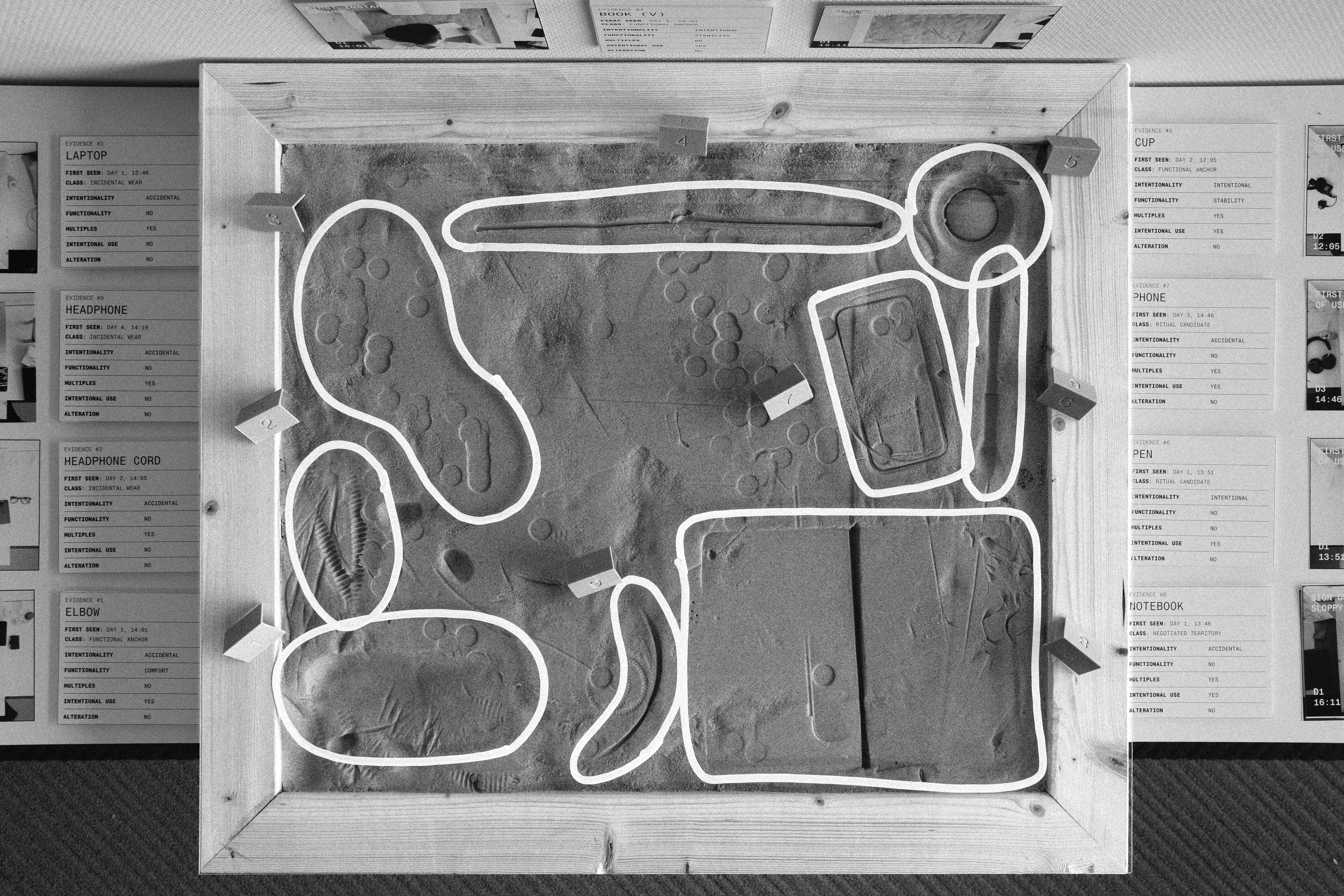 Tabula plaster surface with object outlines traced in white