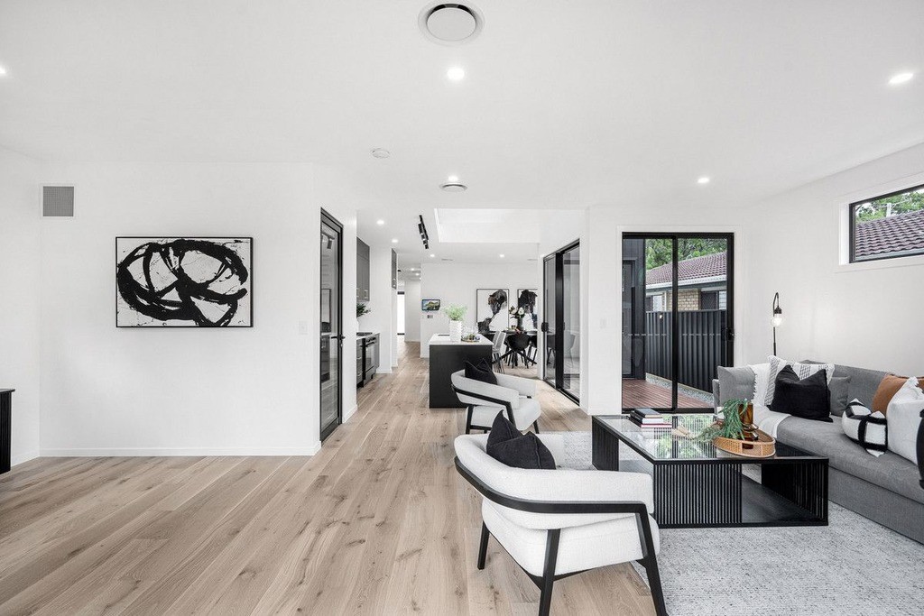 Open-plan Queensland home with hybrid flooring flowing through kitchen and living areas, offering water resistance and slip-resistant comfort for daily life.