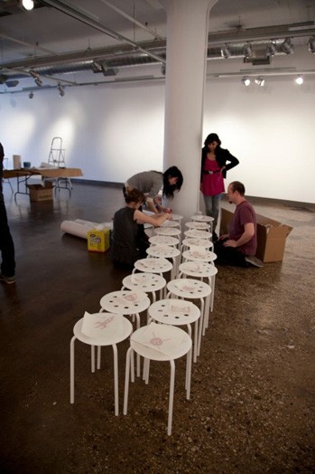 people working on the preparations of the designer as exhibition event