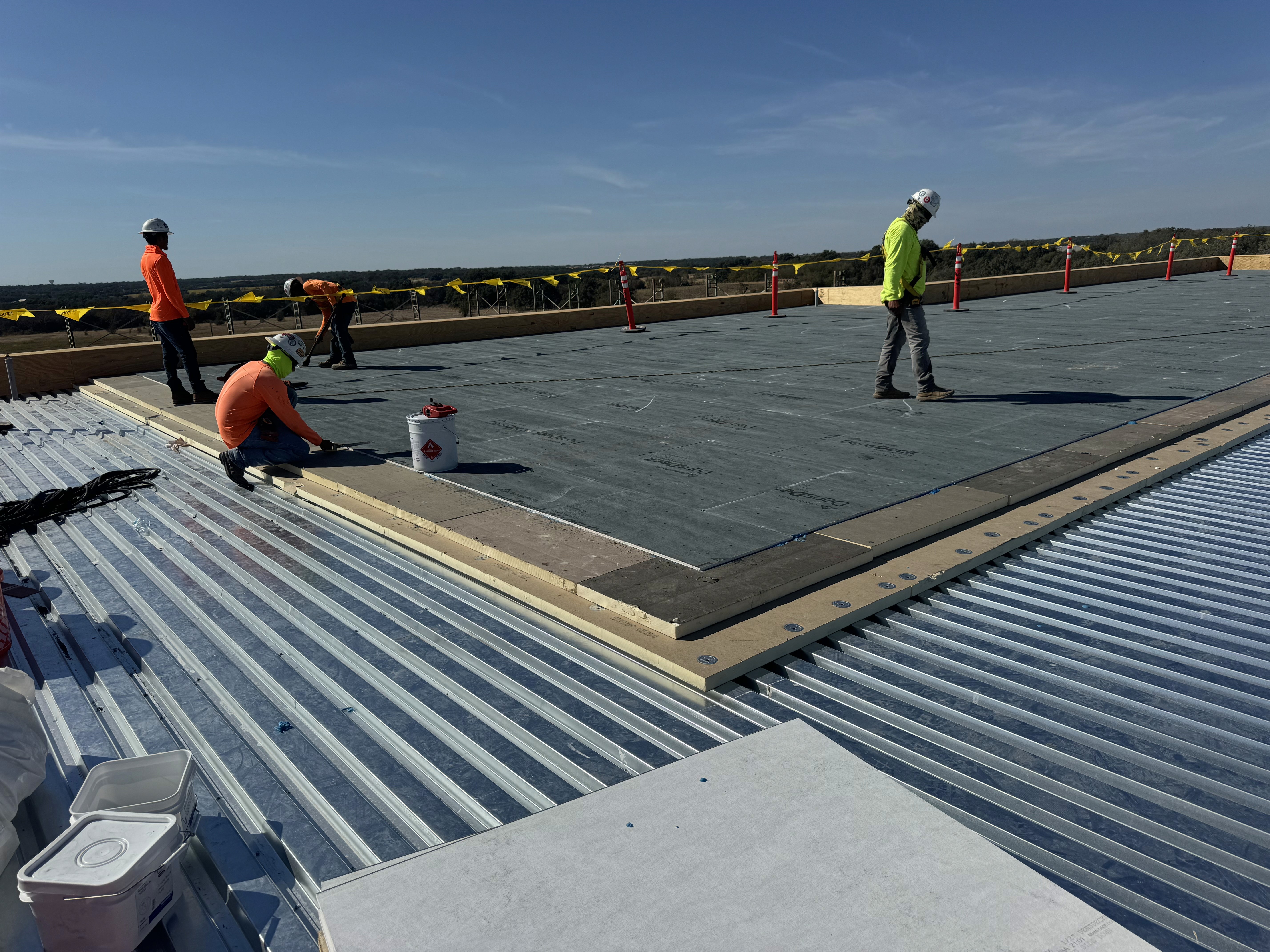 Men working on commercial roof