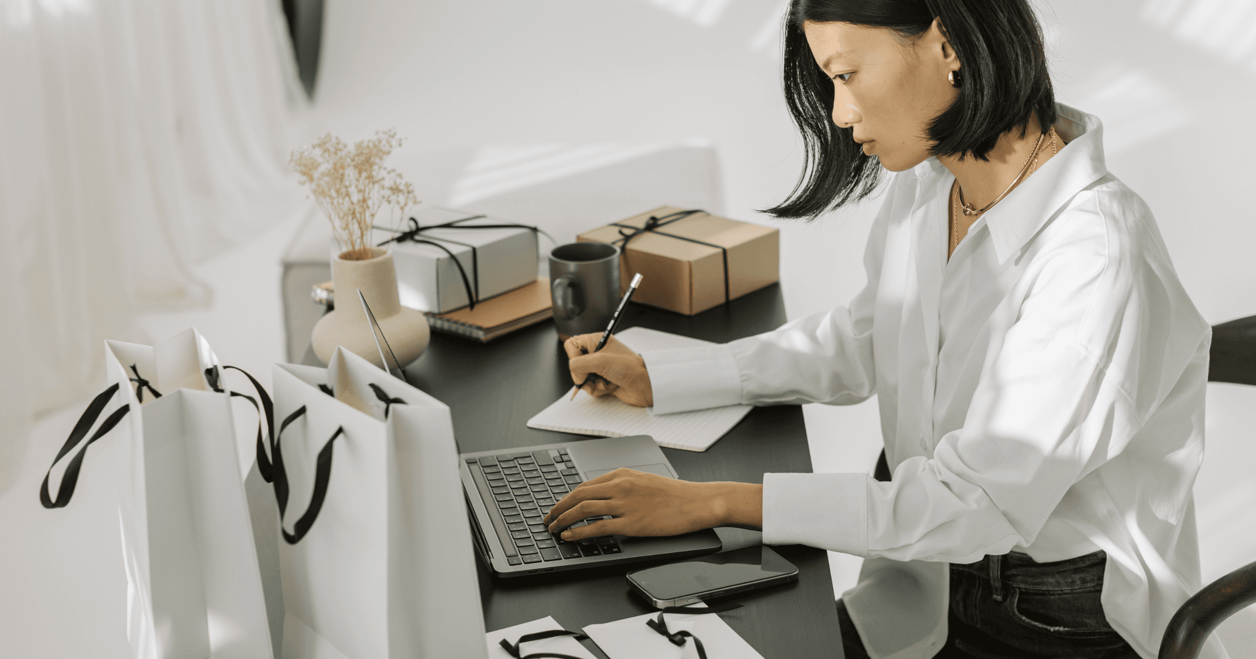A Malaysian business owner working on her laptop