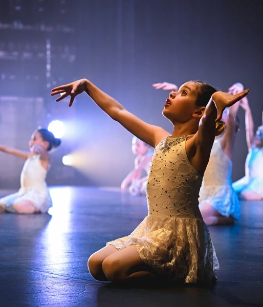 Young dancer performing onstage 