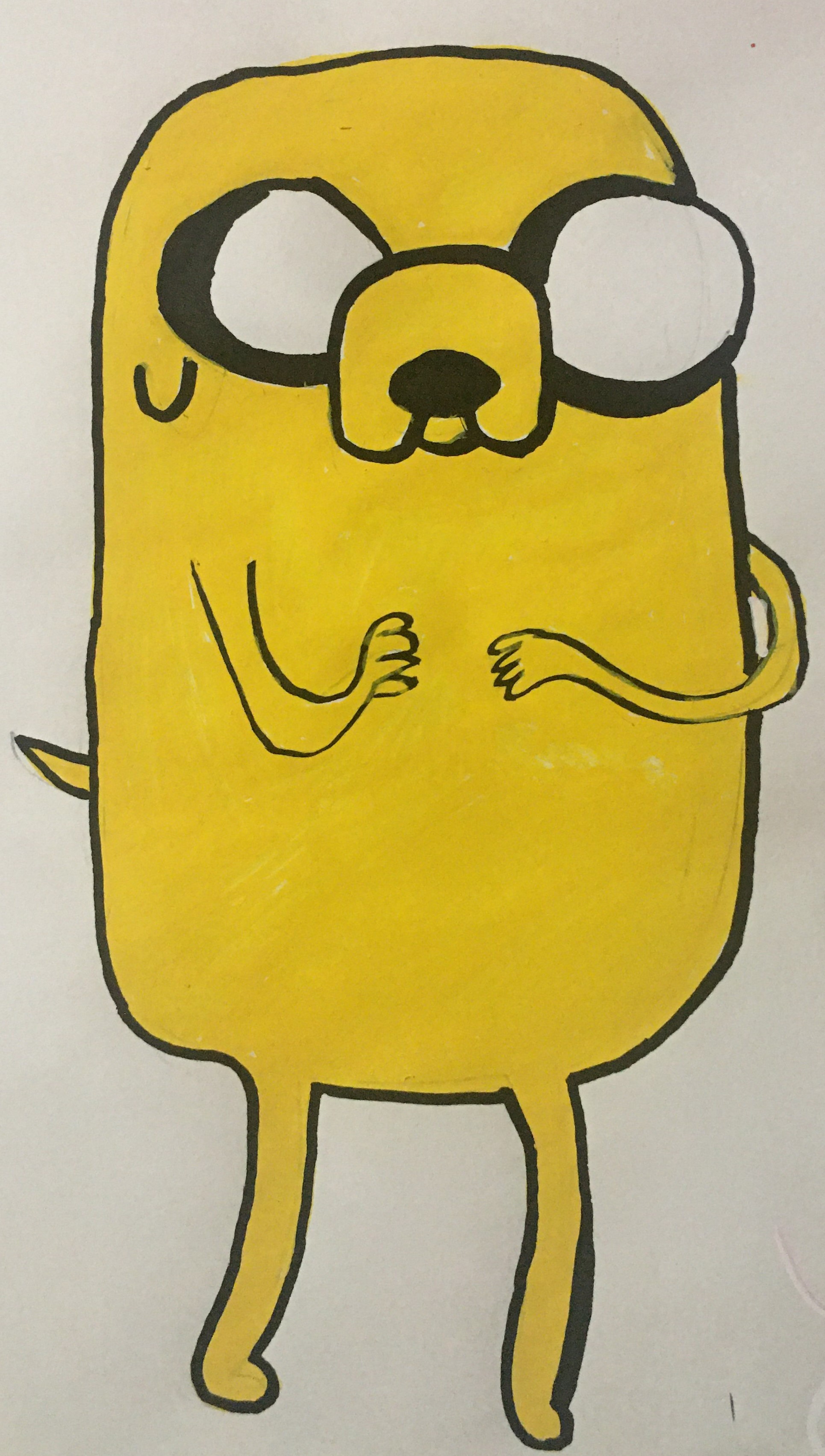 A cartoon character called Jake the Dog from the show "Adventure Time" with a round yellow body and glasses, standing with arms crossed and a playful expression.