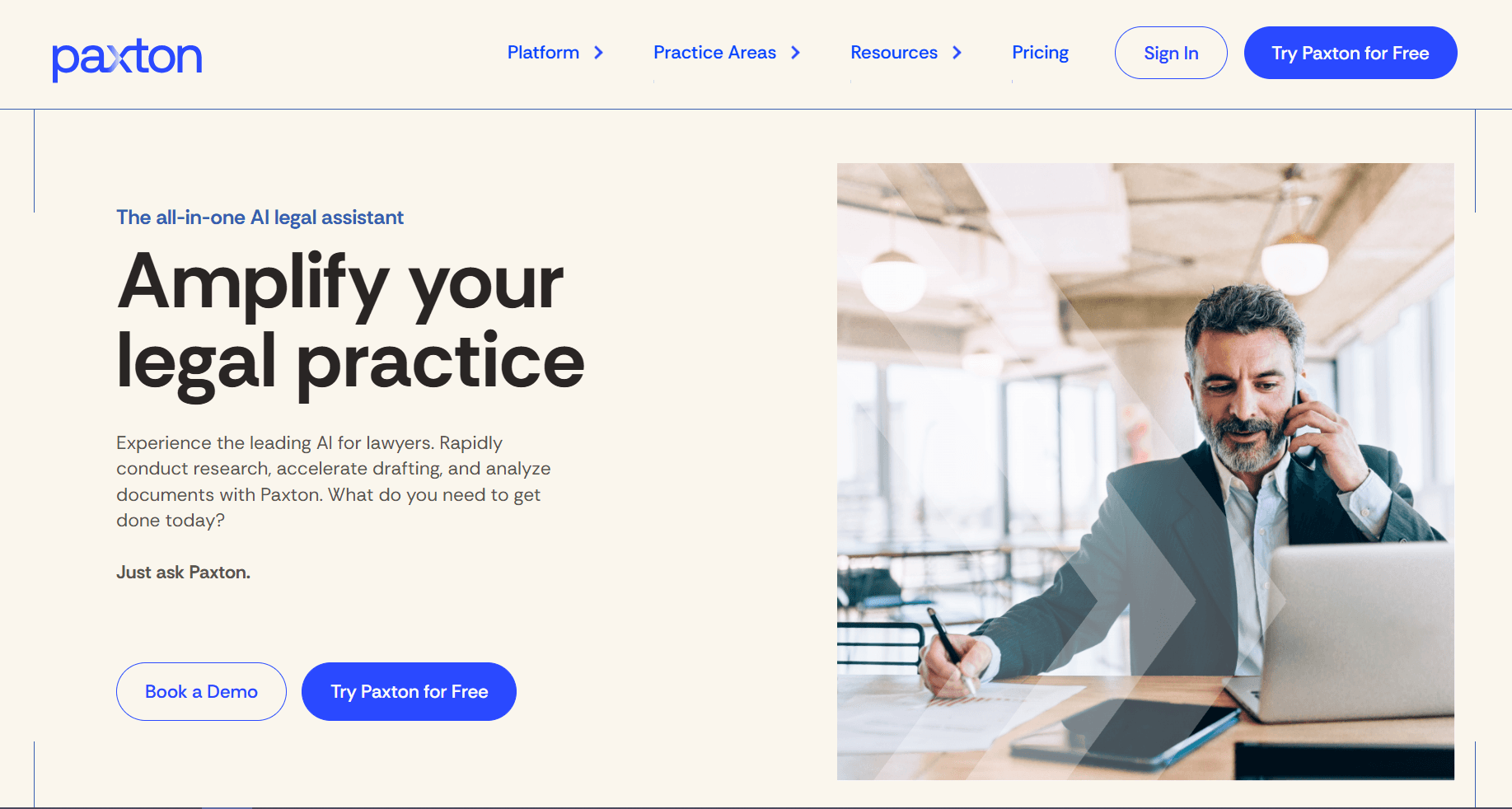 Homepage screenshot of Paxton, an AI legal assistant, featuring the headline “Amplify your legal practice,” call-to-action buttons, and a professional working at a laptop.