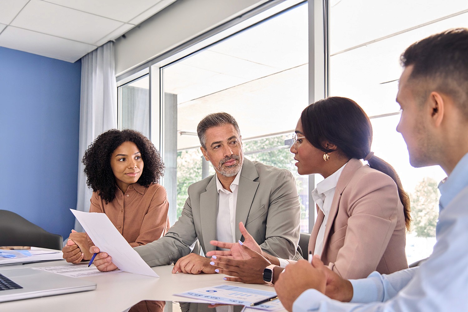 Group of four business colleagues in a meeting