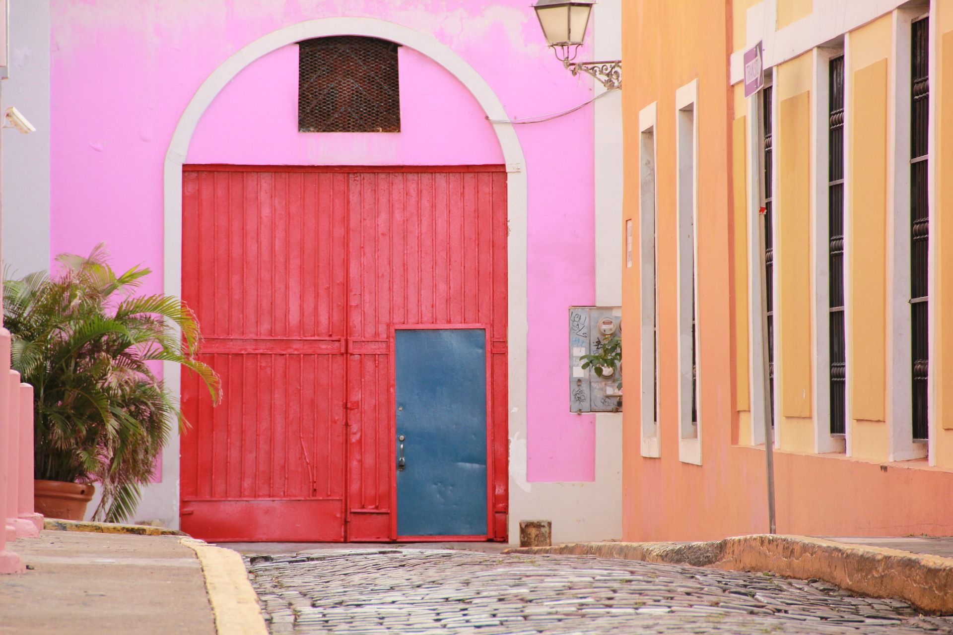 Colorful buildings on a cobblestone street in San Juan
