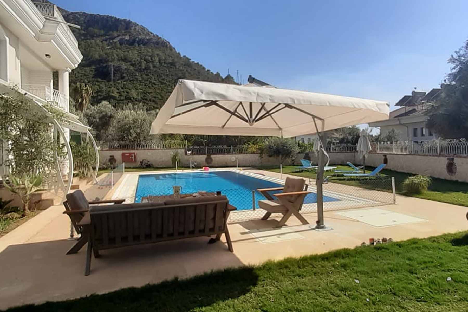 two people looking at a tablet and smiling