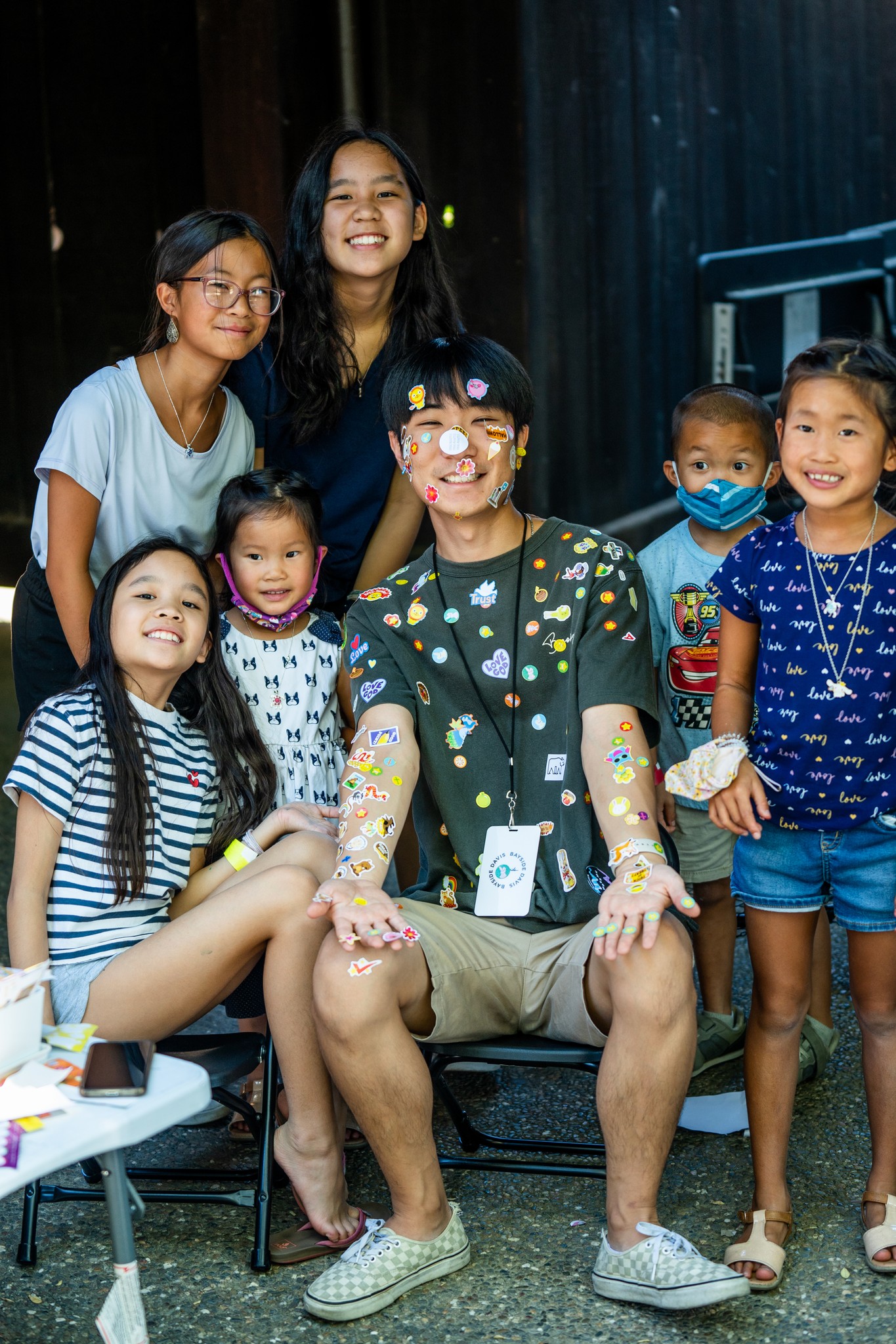 two people looking at a tablet and smiling