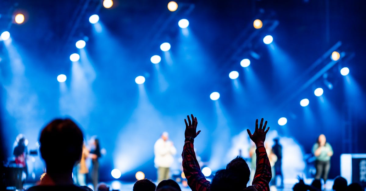 Vibrant concert scene under dynamic stage lighting with audience engagement.