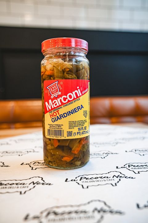 vegan sandwich in a green plate on the white table