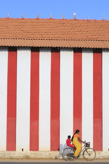a group of women standing on top of a sandy beach