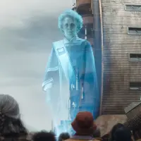 A blue hologram of a woman in a town square