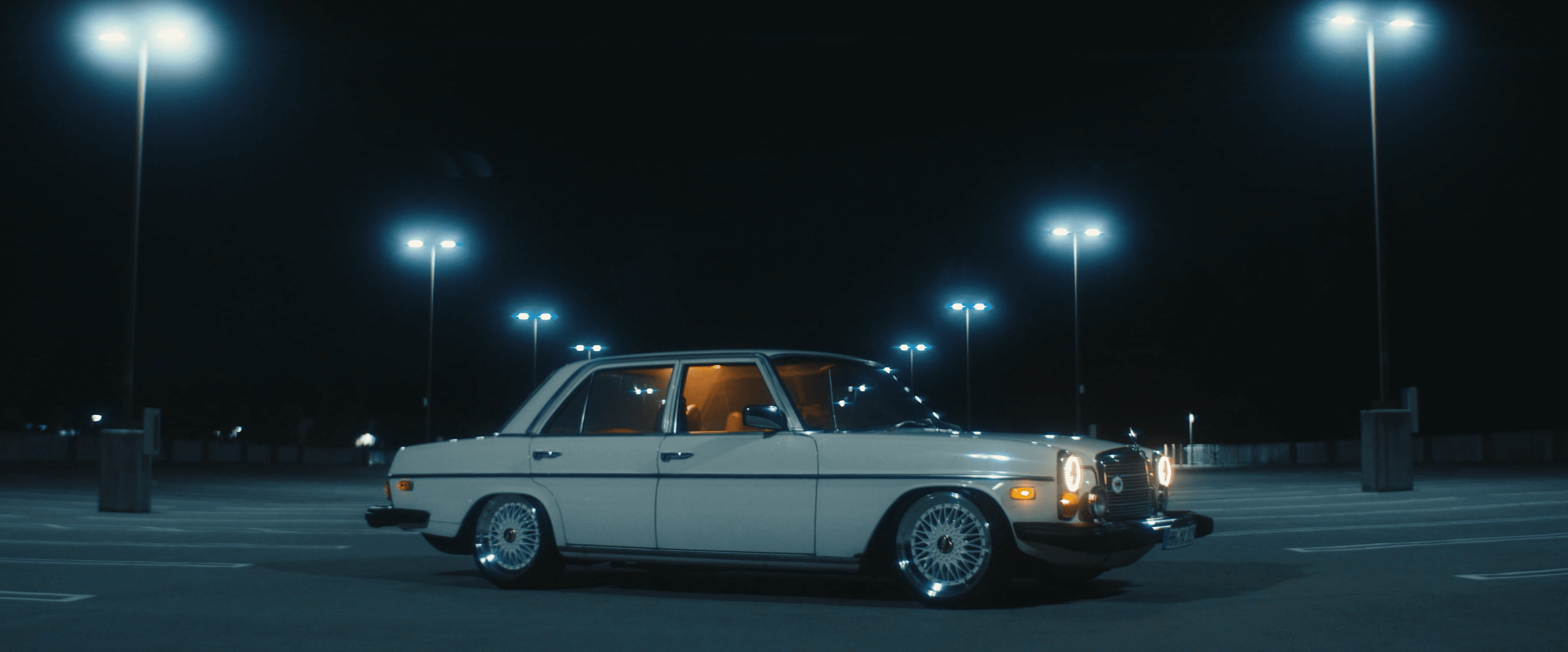 Man wearing an oversized green outfit with cartoon graphic