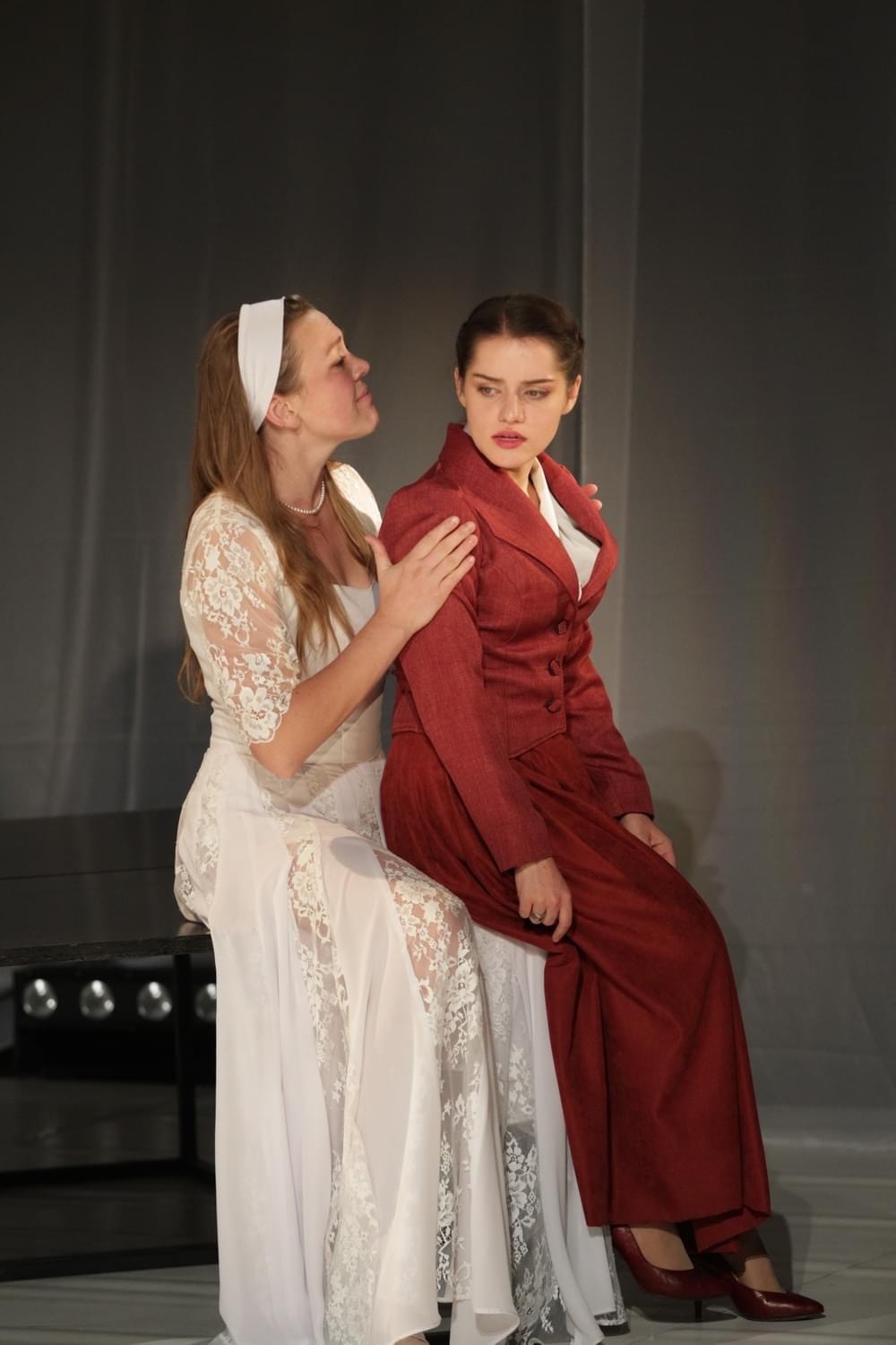Woman holding vintage camera in sunflower field