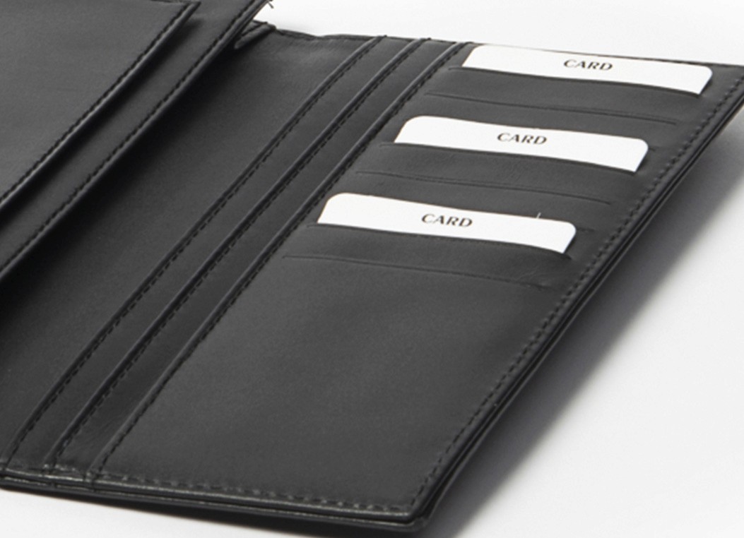 Close-up of the wallet's right panel featuring six card slots filled with white dummy cards.