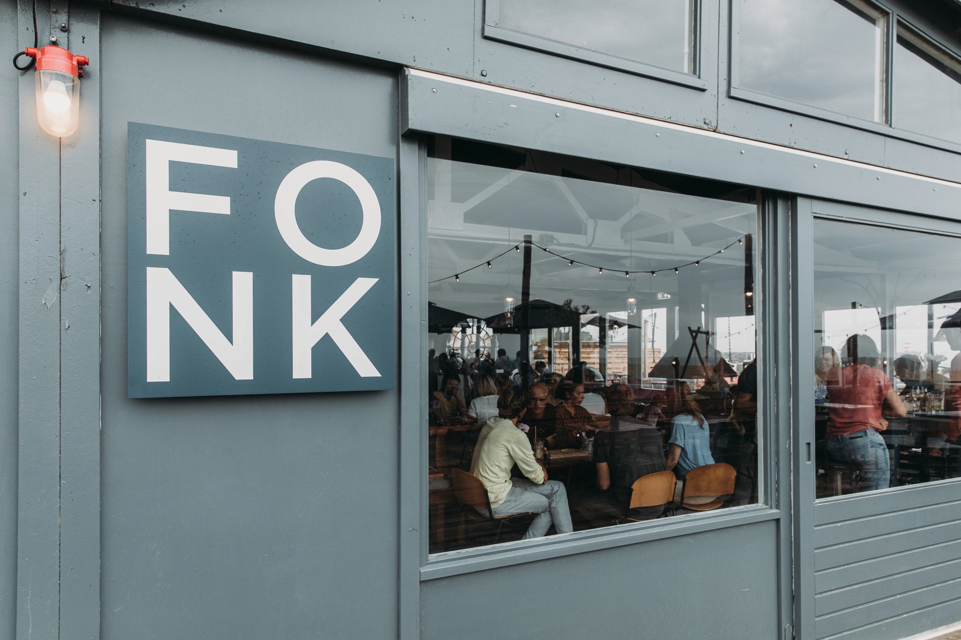 Photo of the facade of Fonk Beach Club with detail of the logo