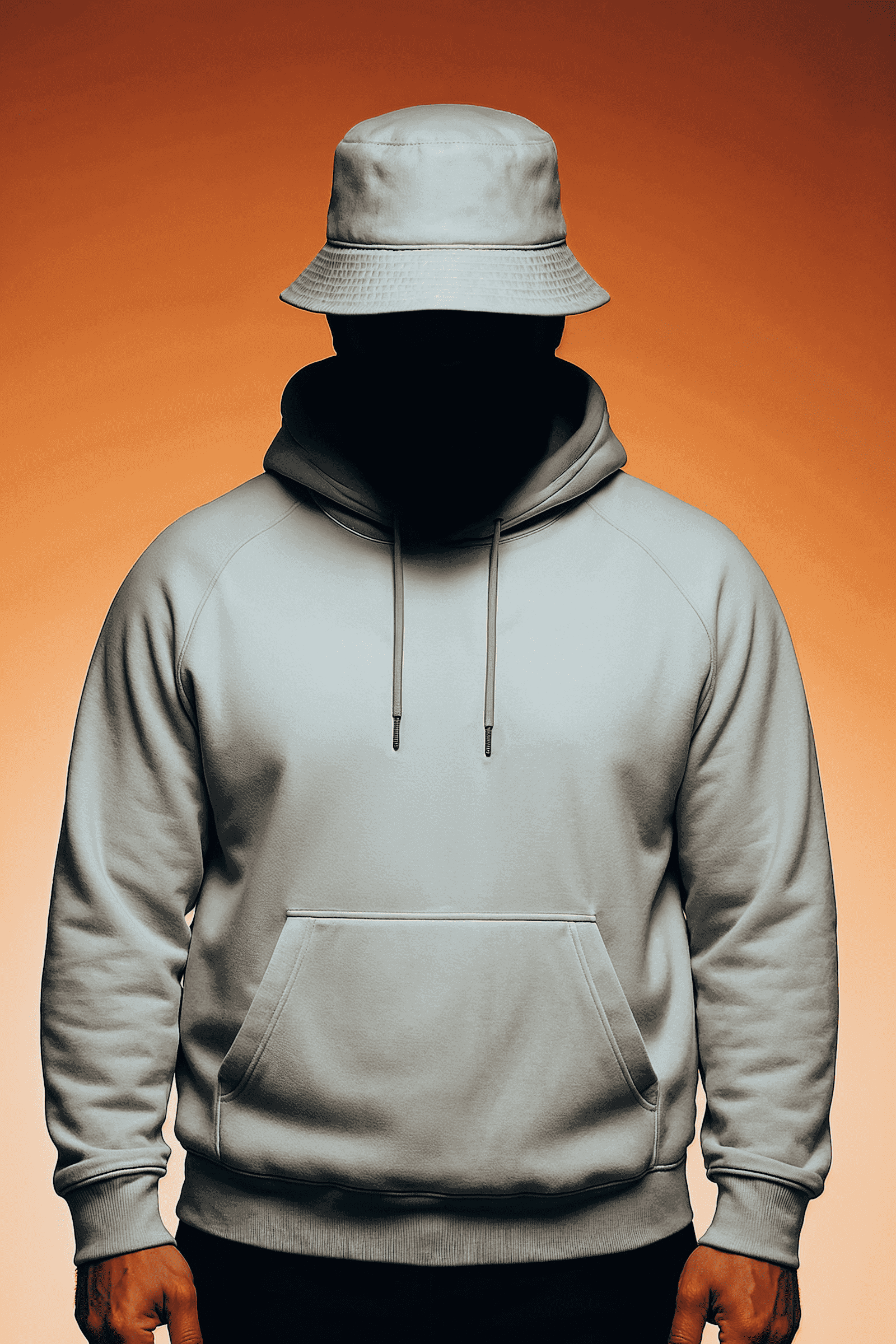 Person wearing white hoodie with arms behind back facing forward