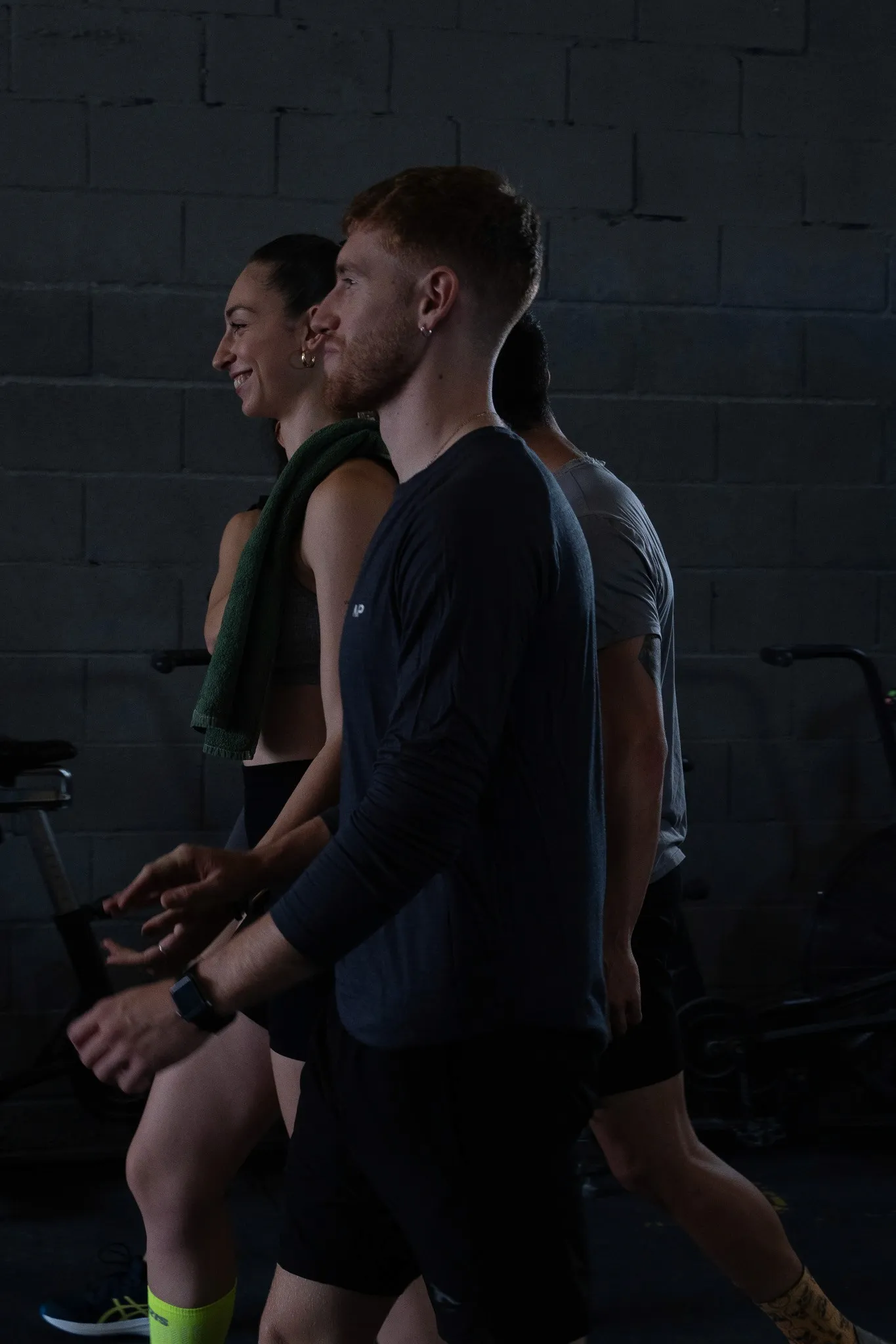 Gray modern farmhouse with ivy, a pool, and lounge chairs in a grassy area.