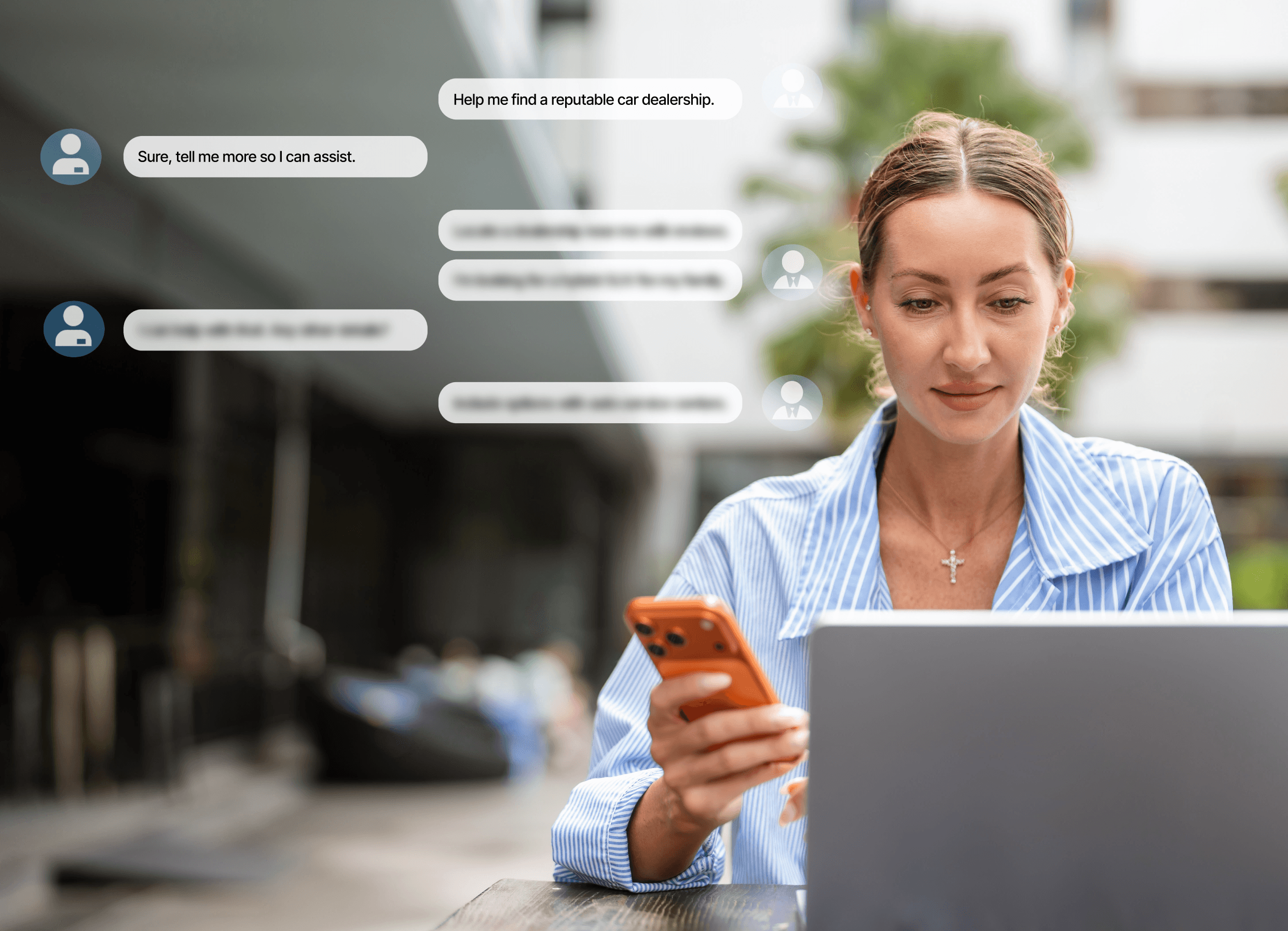 A woman sitting with her laptop and a phone in her hand, using an artificial intelligence chatbot to get automatic responses.