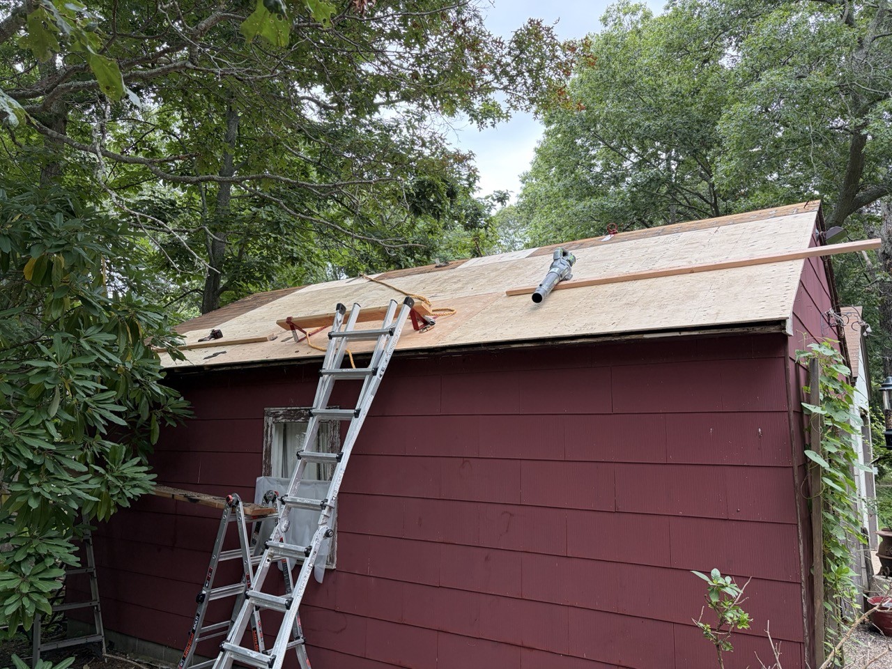 New plywood decking installed across the rebuilt roof
