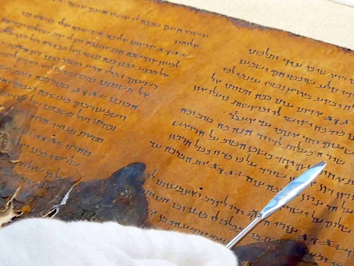 A fragment of a 2,000-year-old Psalms Scroll. Photo courtesy of Yoli Schwartz, Israel Antiquities Authority.