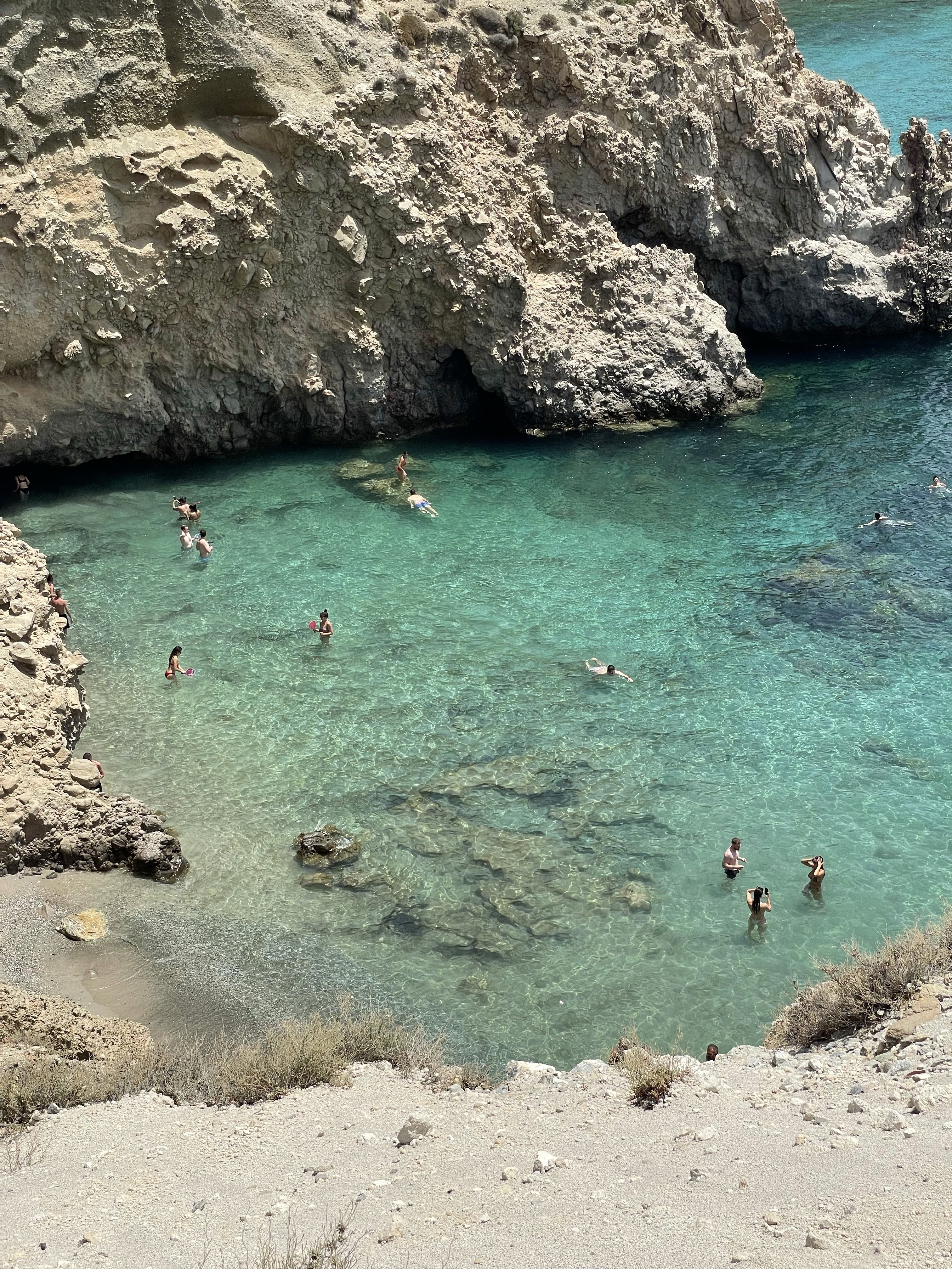 kids lying on a glass land and smiling