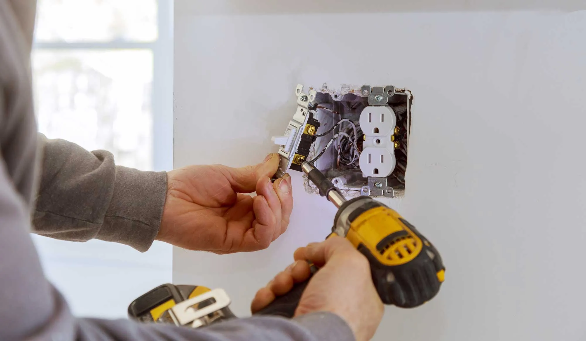 Electrician Installing Power Outlet