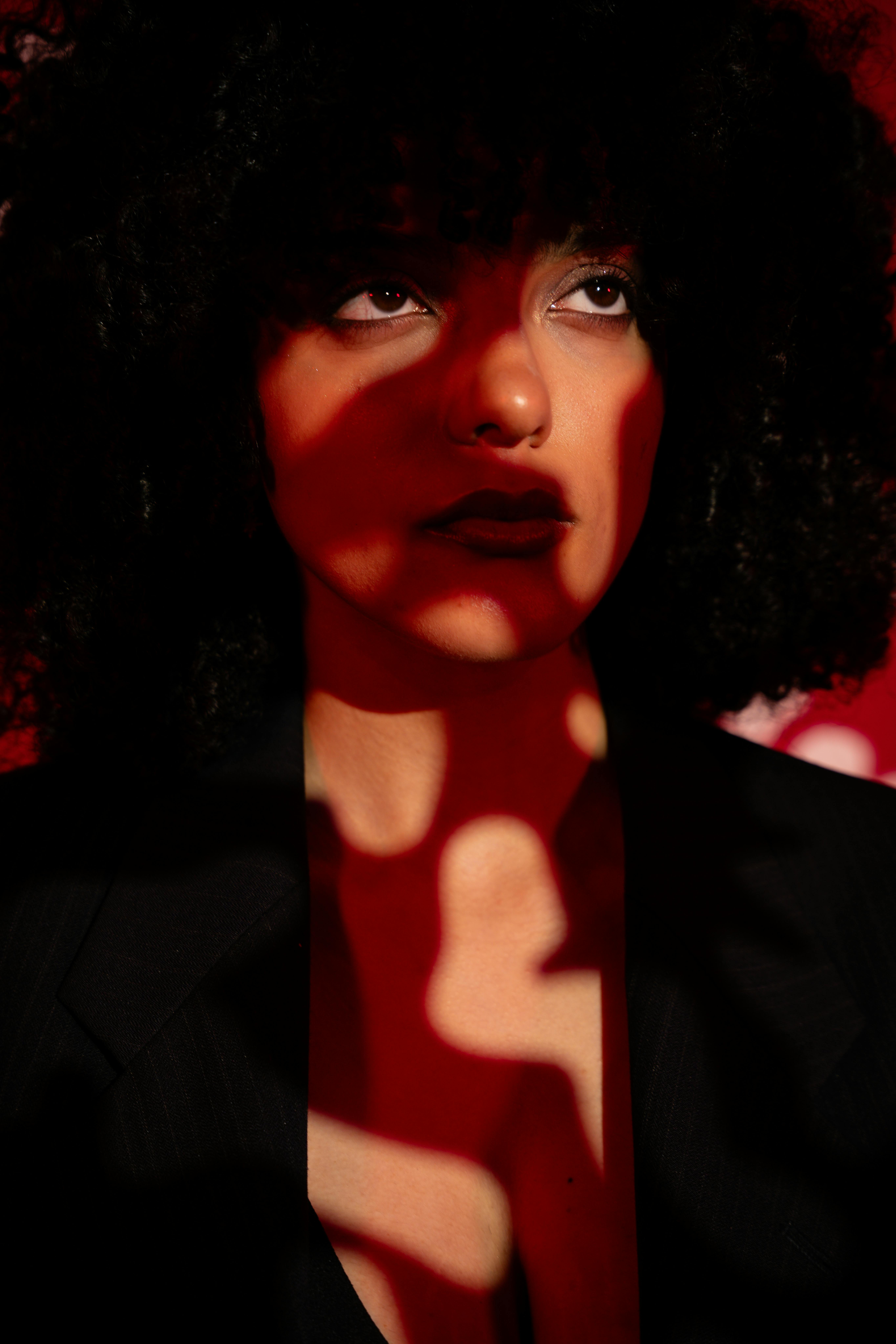 Woman portrait on red background