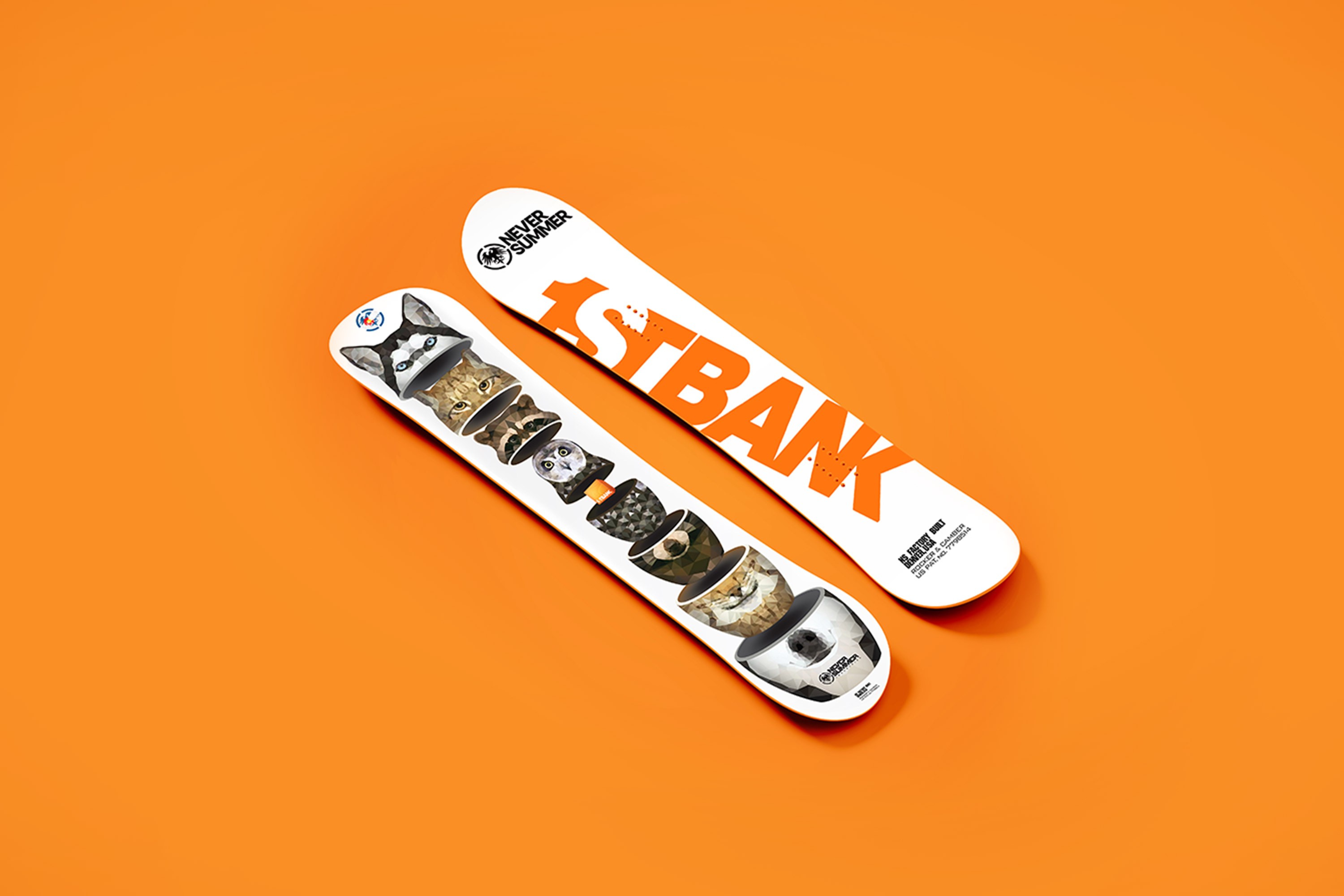 A pair of snowboards on bright orange background.