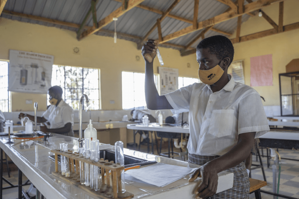 Kenyan high school students conducting original research in a university lab setting