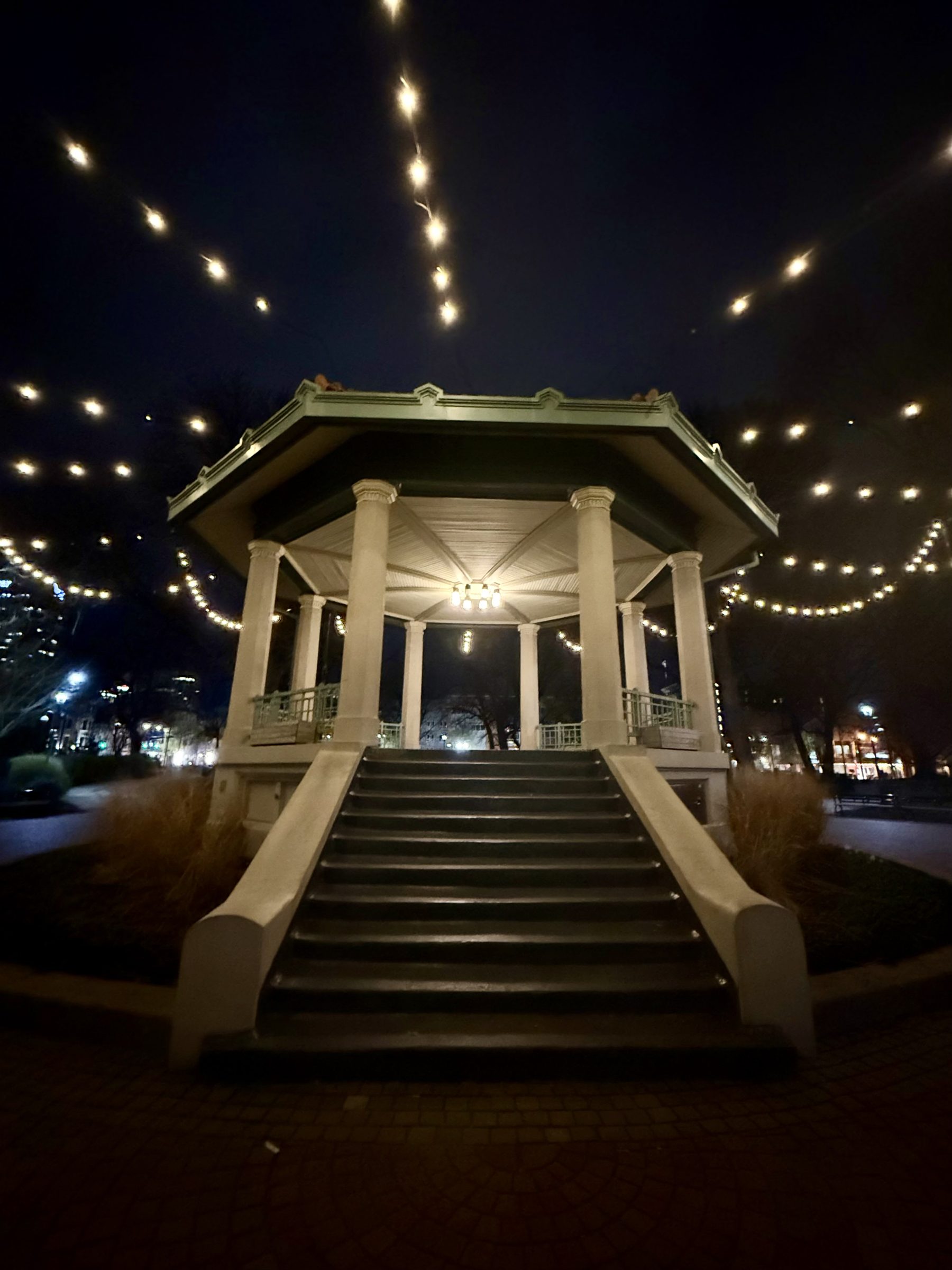 A lit gazebo at night