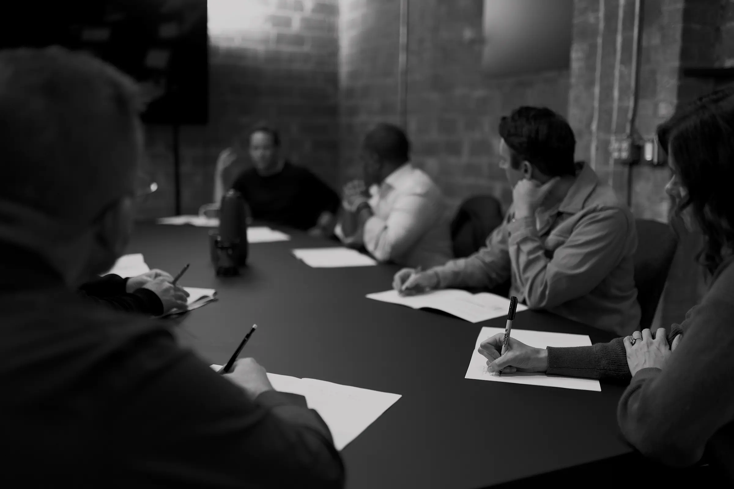 Team working in an office watching at a presentation